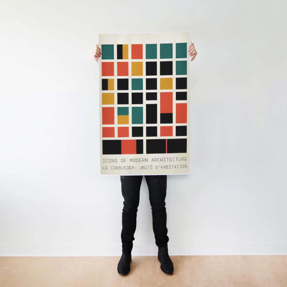 633f87269ab35545e29c41b0_Man-Holding-Poster